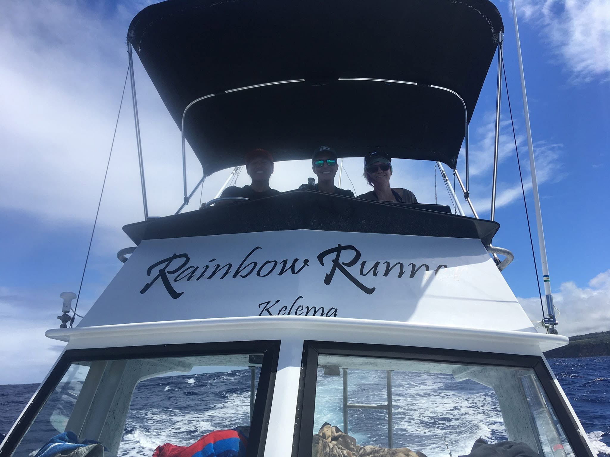 Rainbow Runner name on the cabin while the boat is underway