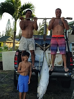 Captain Armelio, his son, and his grandson with a 110-pound ahi in 2017